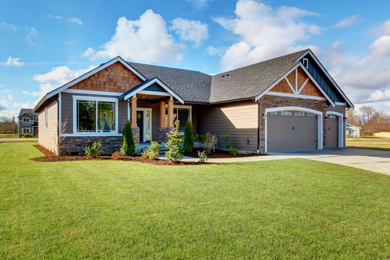 a picture of residential house, with pruned landscaping to showcase security benefits